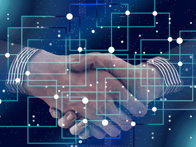 DR. GANADO MODERATES PANELS AT BLOCKCHAIN AND AI CONFERENCE